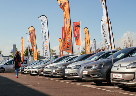 STRASBOURG, FRANCE - OCT 10, 2015: Woman walking through rows of Volkswagen cars choosing the right modelのeditorial素材