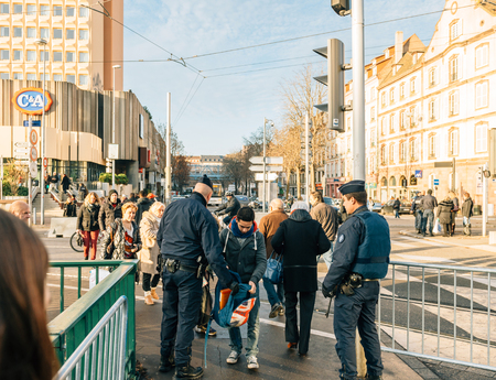 STRASBOURG, FRANCE - DEC 9, 2016: Police check-point verifying all pedestrian before entering city center after extreme secure measures have been taken to prevent any terrorist attacksのeditorial素材