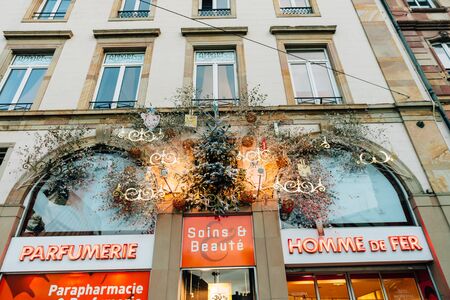 STRASBOURG, FRANCE - DEC 9, 2016: Christmas decorations over old pharmacyのeditorial素材