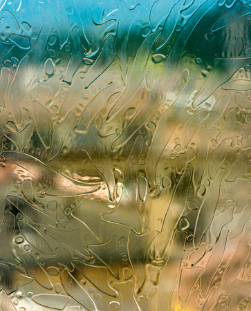 Abstract silhouette of city of Firenze (Florence) as seen through an old stained glass from Palazzo Vecchio on a bright sunny dayの写真素材