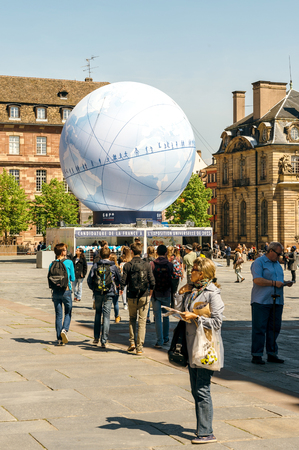 STRASBOURG, FRANCE - MAY 4, 2016: Place de la Cathedrale and Palais Rohan with urban pavilion in central square installed to promote the candidacy of France for the organisation of the World Fair 2025のeditorial素材