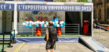 STRASBOURG, FRANCE - MAY 4, 2016: Man walking toward urban pavilion in central square installed to promote the candidacy of France for the organisation of the World Fair 2025のeditorial素材