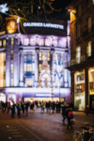 Defocused city with Christmas Atmosphere - tourists and locals walking to find the best gifts in the nearby shopping centerのeditorial素材