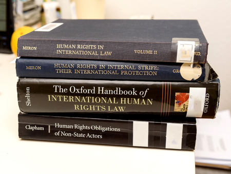PARIS, FRANCE - NOV 27, 2016: Diverse Human Rights law books preparation for examination exam pass, mb and phd thesisのeditorial素材