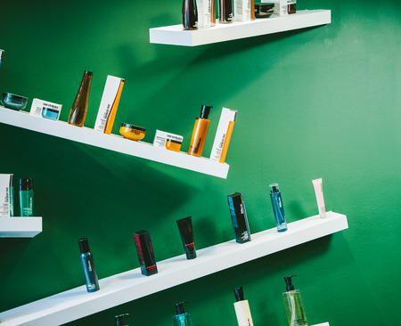 STRASBOURG, FRANCE - AUG 30, 2014: Shu Uemura cosmetics arranged in modern eclectic style in boutique interior. Shu Uemura was a Japanese make-up artist and founder of the Shu Uemura international cosmeticsのeditorial素材