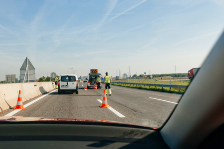 VIENNA, AUSTRIA - SEP 30, 2014: White Volkswagen maintenance security van from ASFiNAG tool road company maintenance of the Austrian autobahn with one lane security division for the workers - working at the border with Hungaryのeditorial素材
