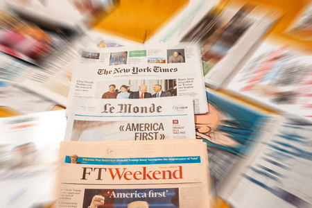 PARIS, FRANCE - JAN 21, 2017: Major international newspaper journalism featuring headlines with Donald Trump inauguration as the 45th President of the United States in Washington, D.Cのeditorial素材