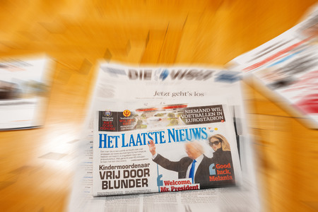 PARIS, FRANCE - JAN 21, 2017: Het Laatste Niewus major international newspaper journalism featuring headlines with Donald Trump and melania Trump inauguration as the 45th President of the United States in Washington, D.Cのeditorial素材