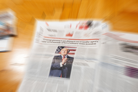 PARIS, FRANCE - JAN 21, 2017: Les Echos newspaper journalism featuring news Donald Trump America First inauguration as the 45th President of the United States in Washington, D.C and relatiosn with Vladimir Putinのeditorial素材