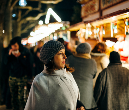 STRASBOURG, FRANCE - DEC 20, 2016: French woman walking between rows of selers at the Christmas MArket of Strasbourg, Frnaceのeditorial素材
