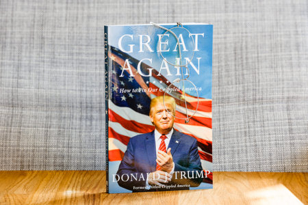 PARIS, FRANCE - FEB 9, 2017: Great Again - how to fix our crippled America biography book by Donald J Trump with reader classic vintage eyeglasses as a bookmark. Crippled America: How to Make America Great Again is a book by Donald Trump, published by Simのeditorial素材
