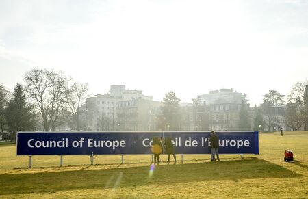STRASBOURG, FRANCE - FEB 2, 2017: Workers taking care of the Council of Europe Conceil de Europe blue signage in front of the international organisation focused on promoting human rights, democracy and the rule of law in Europeのeditorial素材