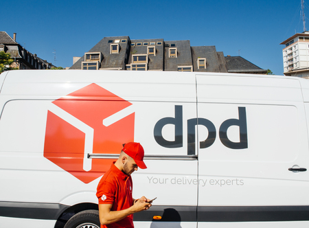 STRASBOURG; FRANCE - JUN 24; 2016: White parcel DPD parcel delivery van with driver worker delivering parcel in French city of Strasbourg. DPD or Dynamic Parcel Distribution is an international parcel delivery company owned by GeoPost.のeditorial素材