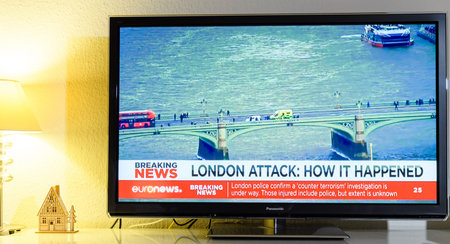 PARIS, FRANCE - MARCH 22: Euronews News channel reporting live scenes from Westminster Bridge after armed attack on March 22 in London. A police officer has been stabbed near to the British Parliamentのeditorial素材