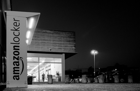 PARIS, FRANCE - FEB 15, 2017: View from below of Amazon locker orange delivery package locker at dusk - Amazon Locker is a self-service parcel delivery service offered by online retailer Amazon.com. Amazon customers can select any Locker location as theirのeditorial素材