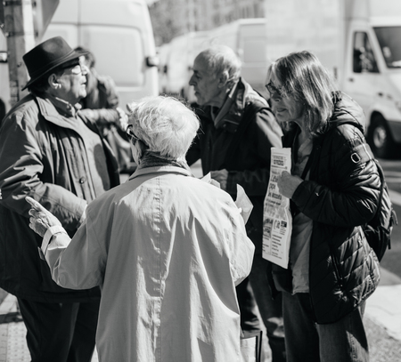 STRASBOURG, FRANCE - APR 8, 2017: Black and white image of political agitation at French market for the upcoming French presidential election 2017 - political discussion at French marketのeditorial素材