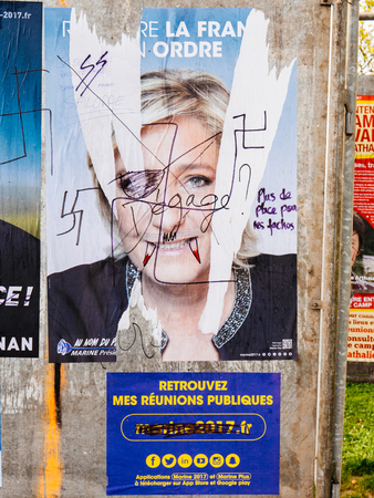 STRASBOURG, FRANCE - APR 12, 2017: Official campaign posters of Marine Le Pen, political party leader of Front national (FN), ones of the eleven candidates running in the 2017 French presidential electionのeditorial素材
