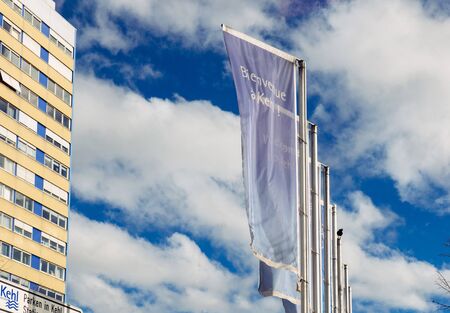 Blue sky, traditional German architecture and Welcome to Kehl flags waving at the entrance of the border city of kehl, near the Franco German border. Kehl is a town in southwestern Germany in the Ortenaukreis, Baden-WÃÂ¼rttemberg. It is located on the riのeditorial素材