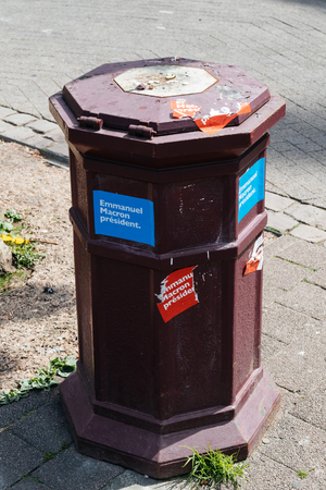 STRASBOURG, FRANCE - APR 23, 2017: Street garbage bin with Emmanuel Macron stickers as seen in France during Presidential Elections Dayのeditorial素材