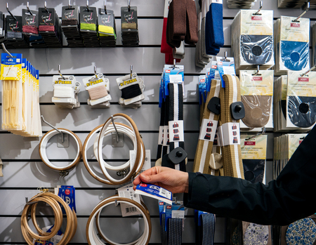 STRASBOURG, FRANCE - APR 27, 2017: Interior of Textile Tissue Fabric shop with multicolored and diverse accessories for sewing tools and accessories stitching kitのeditorial素材