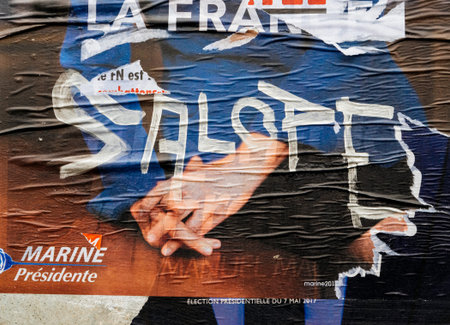 STRASBOURG, FRANCE - MAY 7, 2017: Vandalized Marine Le Pen campaign poster with Salope word near polling place during the second round of the French presidential election to choose between Emmanuel Macron and Marine Le Penのeditorial素材