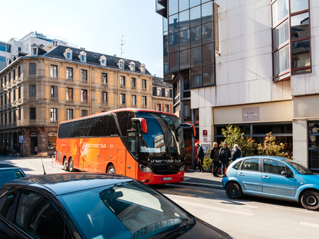 STRASBOURG, FRANCE - APR 27, 2017: German tourists descending red Setra unser rotter bus for Mercure Hotel in central Strasbourg on a sunny spring dayのeditorial素材