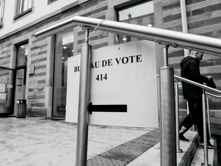 STRASBOURG, FRANCE - MAY 7, 2017: French city with people man leaving polling place during the second round of the French presidential election to choose between Emmanuel Macron and Marine Le Penのeditorial素材