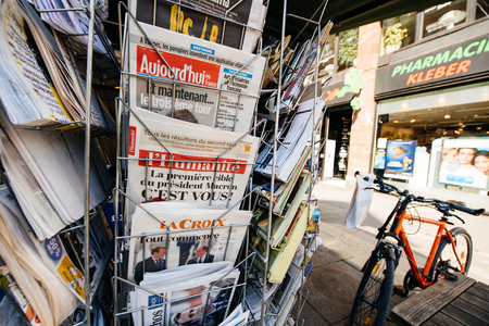PARIS, FRANCE - MAY 9, 2017: INternational press newspapers front pages with the picture of the newly elected French president Emmanuel Macron after the second round French Presidential electionのeditorial素材