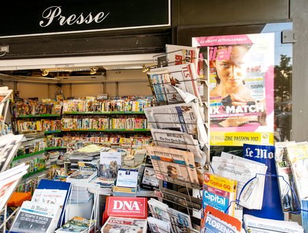 PARIS, FRANCE - MAY 9, 2017: French Press Kisok with international newspapes with the picture of the newly elected French president Emmanuel Macron after the second round French Presidential electionのeditorial素材