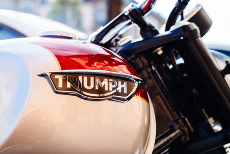 STRASBOURG, FRANCE - APR 3, 2017: Triumph Motorcycles logotype on a parked bike on city street. Triumph is the largest British motorcycle manufacturer; it was established in 1984 by John Bloor after the original company Triumph Engineering went into receiのeditorial素材