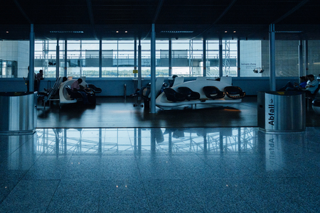Interior of Frankfurt airport with people waiting for their airline, delayed flight or plane arrival departureのeditorial素材