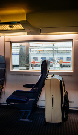 Interior of white luggage bag inside ICE Inter City Express fast german train at Karlsruhe train stationのeditorial素材