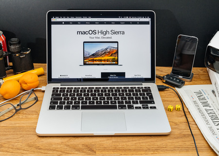 PARIS, FRANCE - JUNE 6, 2017: Apple Computers website on MacBook Retina in creative environment showcasing latest macOS High Sierra from Apple at WWDC 2017 - presentation of the new operating systemのeditorial素材