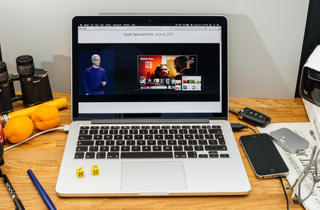 PARIS, FRANCE - JUNE 6, 2017: Apple Computers website on MacBook laptop in creative environment showcasing news from Apple at WWDC 2017 - Tim cook about Watch Nowのeditorial素材