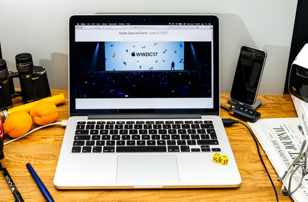 PARIS, FRANCE - JUNE 6, 2017: Apple Computers website on MacBook Retina in creative environment showcasing Tim Cook welcomes developers from 75 different countries WWDC 2017のeditorial素材