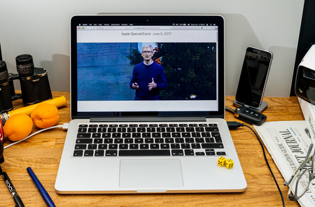 PARIS, FRANCE - JUNE 6, 2017: Apple Computers website on MacBook Retina in creative environment showcasing Tim Cook welcomes developers from 75 different countries WWDC 2017のeditorial素材