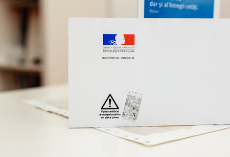PARIS, FRANCE - OCT 26, 2016: Special postal envelope of  with the logo of The Ministry of the Interior (Ministere de l'IntÃ©rieur) with the special mark that vehicle registration certificate (certificat d'immatriculation known also as carte grise) is encのeditorial素材