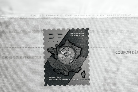 PARIS, FRANCE - OCT 26, 2016: Close-up of the security holographic stamp issued by the The Ministry of the Interior Ministere de l'Interieur on the vehicle registration certificate (certificat d'immatriculation known also as carte grise) with special holoのeditorial素材