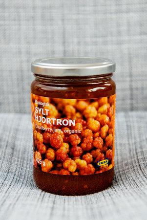 PARIS, FRANCE - OCT 25, 2016: IKEA food package - Swedish jam made from organic cloudberry fruits. IKEA Foods is a division of IKEA furniture. IKEA is a Scandinavian chain selling ready-to-assemble furniture, plus housewares, in a warehouse-like space.のeditorial素材