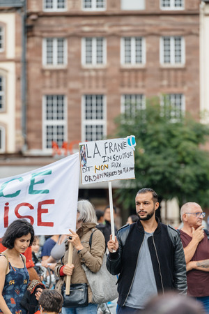 STRASBOURG, FRANCE - JUL 12, 2017: Protesters with placards at protest against Macron government spending cuts and pro-business tax and labor reformsのeditorial素材