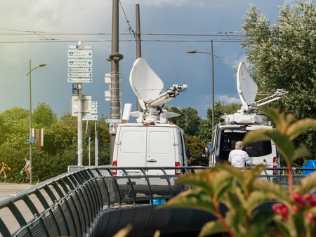 STRASBOURG, FRANCE - JUN 30, 2017: RTL N:TV TV Media Television Trucks with multiple Satellite parabolic antennas and fiber optic cables preparing to report live the official European Ceremony of Honour for Dr. Helmut Kohl at European Parliamentのeditorial素材