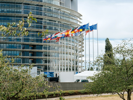 STRASBOURG, FRANCE - JUN 30, 2017: Front view of European Union flag fly at European Parliament buildingのeditorial素材