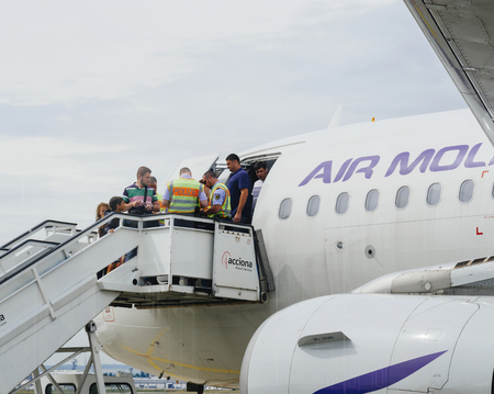 FRANKFURT, GERMANY - AUG 8, 2017: German police Polizei and Zoll Customs workers inspecting the passengers passports of Air Moldova Airbus aircraft on the airstair before descending - searching for illegal migrations and terrorists - Frankfurt Internationのeditorial素材
