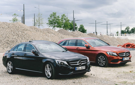 LEIPZIG, GERMANY - JUL 30, 2017: Two Mercedes-Benz  C-Class W205 black sedan and red station wagon