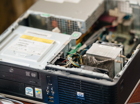MOSCOW, RUSSIA - AUG 7, 2017: Massive dust particles covering the HP-Compaq personal computer heatsink, preparing to repair and clean the computer for better operationのeditorial素材