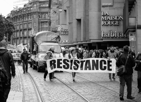 STRASBOURG, FRANCE - SEPT 12, 2017: Demonstrators with Resistance banner at political march during a French Nationwide day of protest against the labor reform proposed by Emmanuel Macron Governmentのeditorial素材