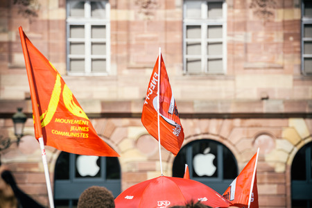 STRASBOURG, FRANCE - SEPT 12, 2017: Young communist movement flags at political march during a French Nationwide day of protest against the labor reform proposed by Emmanuel Macron Governmentのeditorial素材