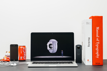 PARIS, FRANCE - SEP 13, 2017: Minimalist creative room  Safari Browser open on MacBook Pro laptop showcasing Apple Keynote website - Apple COO Jeff Williams presenting the Apple Watch 3 sensors healthのeditorial素材