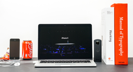 PARIS, FRANCE - SEP 13, 2017: Minimalist creative room and Safari Browser on MacBook Pro laptop showcasing Apple Keynote website with Phil Schiller Apple marketing chief  presenting the new iPhone X 10のeditorial素材