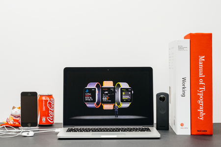 PARIS, FRANCE - SEP 13, 2017: Minimalist creative room  Safari Browser open on MacBook Pro laptop showcasing Apple Keynote website - Apple COO Jeff Williams presenting the Apple Watch 3 health and sport appのeditorial素材